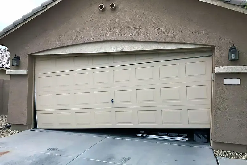 Garage door stuck crooked and uneven from outside